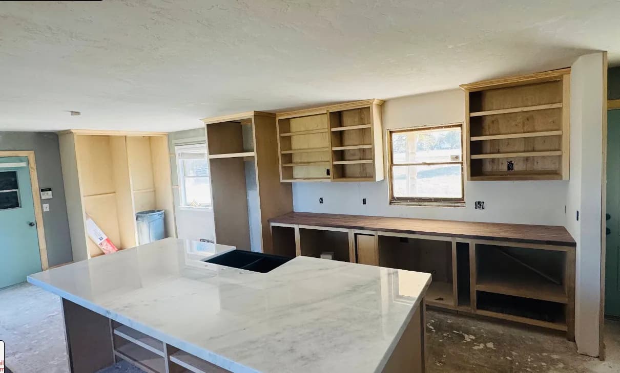 Kitchen remodel with updated cabinetry and stone surfaces